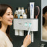 Wall-mounted magnetic inverted toothbrush holder with automatic toothpaste squeezer